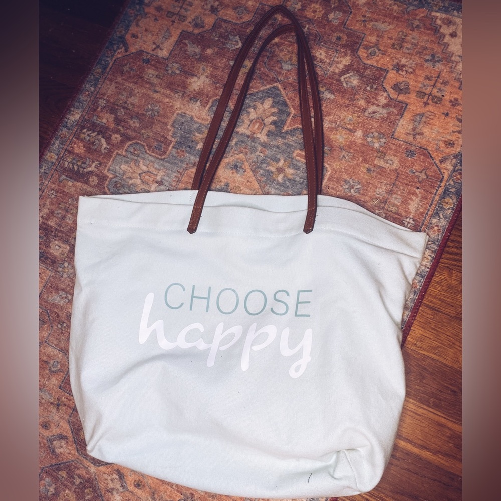 “Choose Happy” Tote, Canvas Fabric light blue color with leather handles.